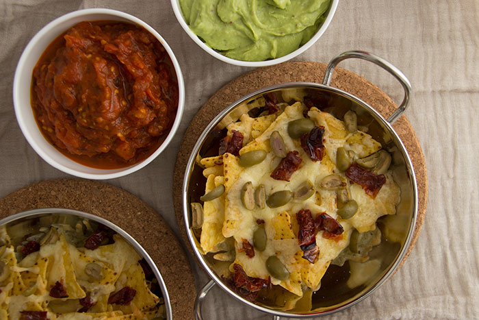 Nachos with cheese, guacamole and tomato sauce