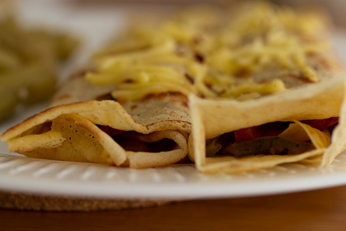 Onion and pepper crepes. Close up